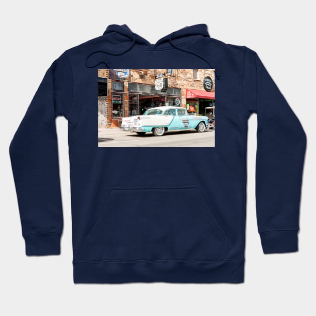 Street scene in Route 66 town with vintage shop signage and Chev car Hoodie by brians101